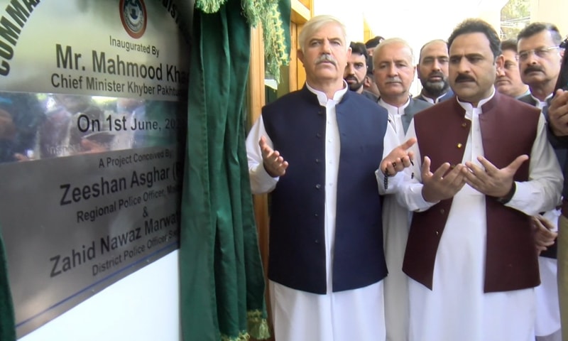 Khyber Pakhtunkhwa Chief Minister Mahmood Khan (L)  inaugurates the newly-established Police Command and Control Centre at the District Police Office in Swat. &mdash; Photo courtesy KP police Twitter