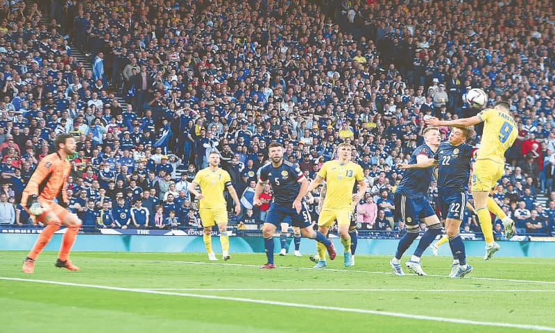 GLASGOW: Ukraine’s Roman Yaremchuk heads to score against Scotland during their World Cup play-off at Hampden Park.—AFP GLASGOW: Ukraine’s Roman Yaremchuk heads to score against Scotland during their World Cup play-off at Hampden Park.—AFP