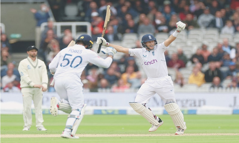 LONDON: England batter Joe Root (R) celebrates beating New Zealand in their first Test at Lord’s on Sunday.—Reuters LONDON: England batter Joe Root (R) celebrates beating New Zealand in their first Test at Lord’s on Sunday.—Reuters