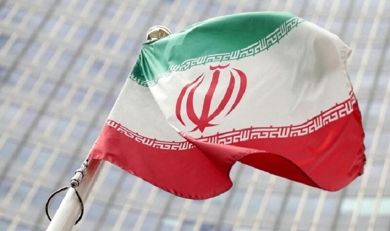 The Iranian flag flutters in front the International Atomic Energy Agency (IAEA) headquarters in Vienna, Austria. — Reuters/File
