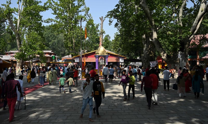 Hindu devotees gather during the annual 'Mela Kheer Bhawani' festival at a temple in Tullamulla village on the outskirts of Srinagar on June 8, 2022. — AFP