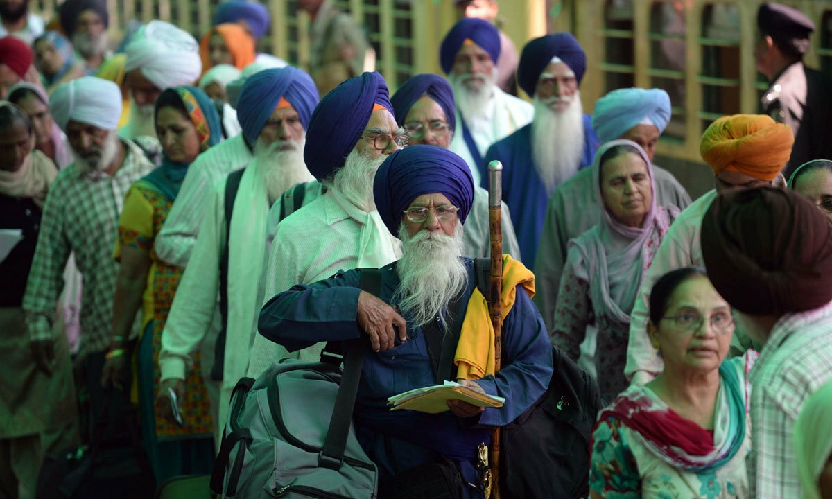 Indian Sikh pilgrims arrive at Wagah Railway Station in Wagah. – AFP/File