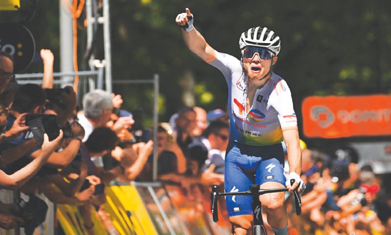 TOTALENERGIES team’s Valentin Ferron of France celebrates after crossing the finish line to win the sixth stage of Criterium du Dauphine on Friday.—AFP TOTALENERGIES team’s Valentin Ferron of France celebrates after crossing the finish line to win the sixth stage of Criterium du Dauphine on Friday.—AFP