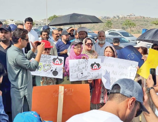 Residents of Bahria Town protest against prolonged power loadshedding and water shortage in their area. &mdash; Photo by Zaki Khalid/twitter