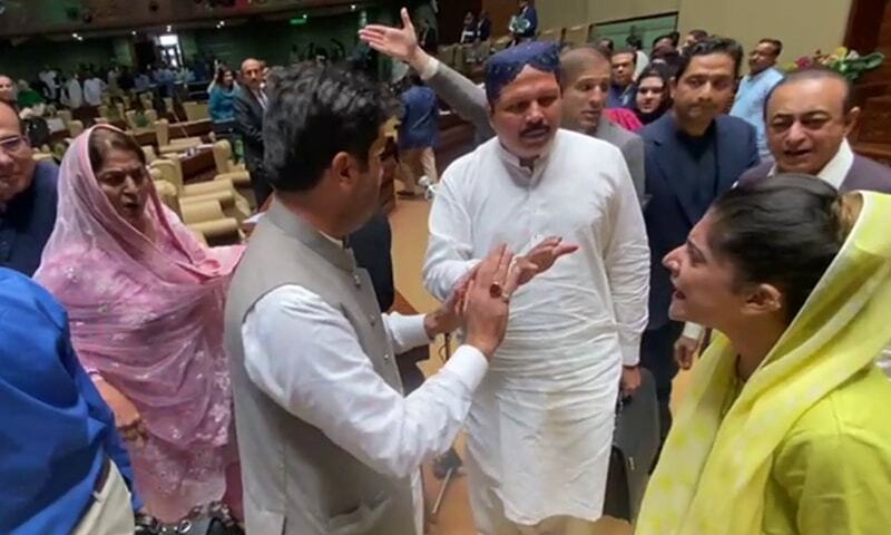 The lawmakers belonging to the PTI and the PPP bicker during a budget session in the Sindh Assembly on Tuesday. — DawnNewsTV