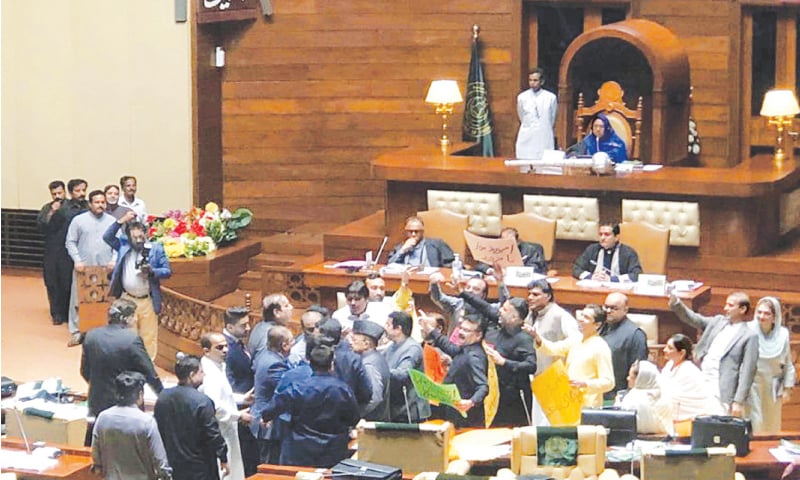 Lawmakers belonging to the opposition Pakistan Tehreek-i-Insaf and ruling Pakistan Peoples Party engage in a heated argument during the Sindh Assembly session held to present provincial budget for financial year 2022-23 on Tuesday.—PPI