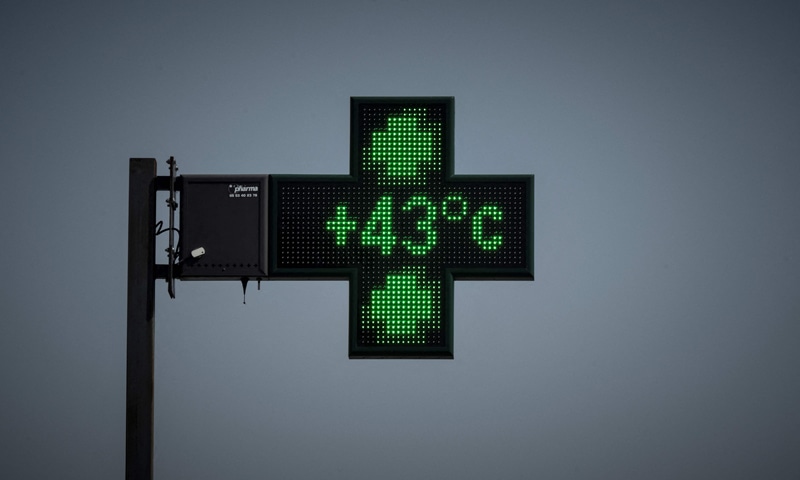 A pharmacy thermometer shows a temperature of 35 degrees Celsius during a heatwave in Toulouse, France