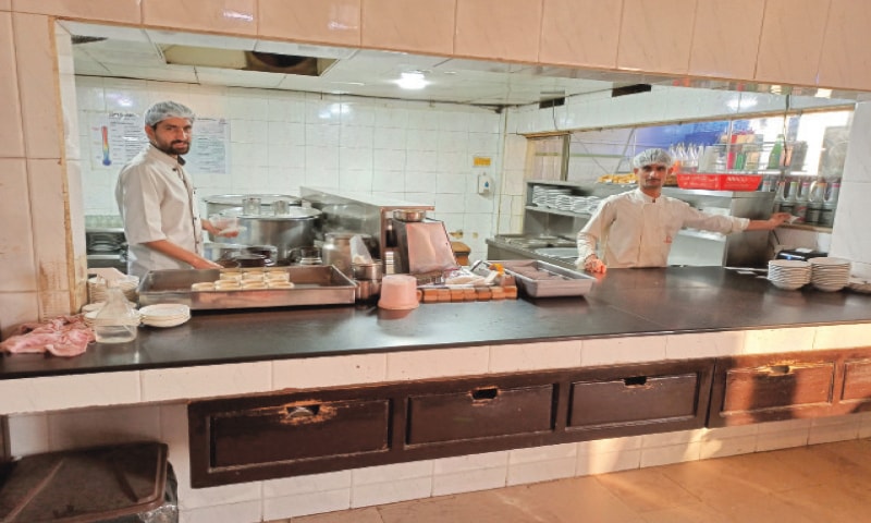 The kitchen counter with the proud but busy chefs