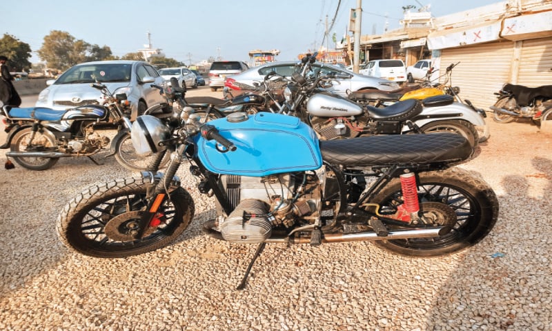 A Harley-Davidson, the most prominent among the fleet of heavy bikes parked outside Cafe Imran