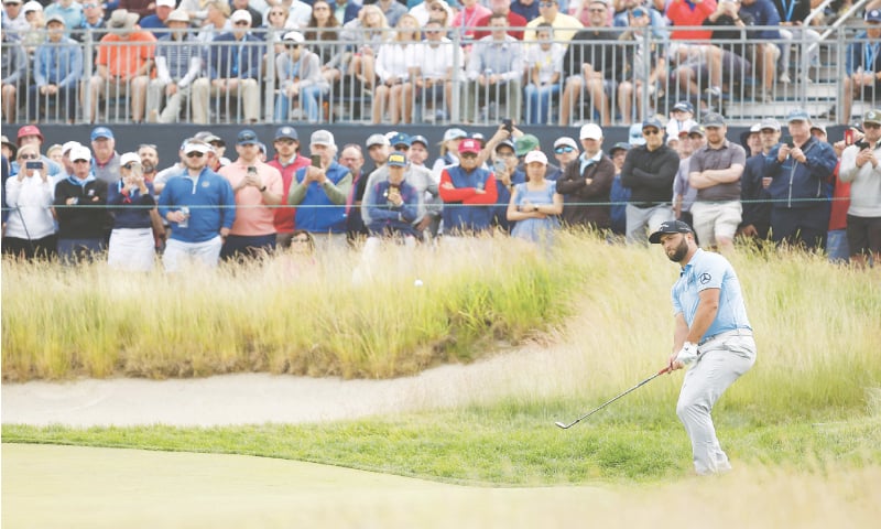 JON Rahm of Spain chips on the second green during the third round of the US Open at The Country Club.
&mdash;AFP
