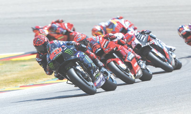 HOHENSTEIN-ERNSTTHAL: Monster Energy Yamaha&rsquo;s Fabio Quartararo (front) of France and other contestants in action during the German MotoGP at Sachsenring on Sunday.&mdash;Reuters