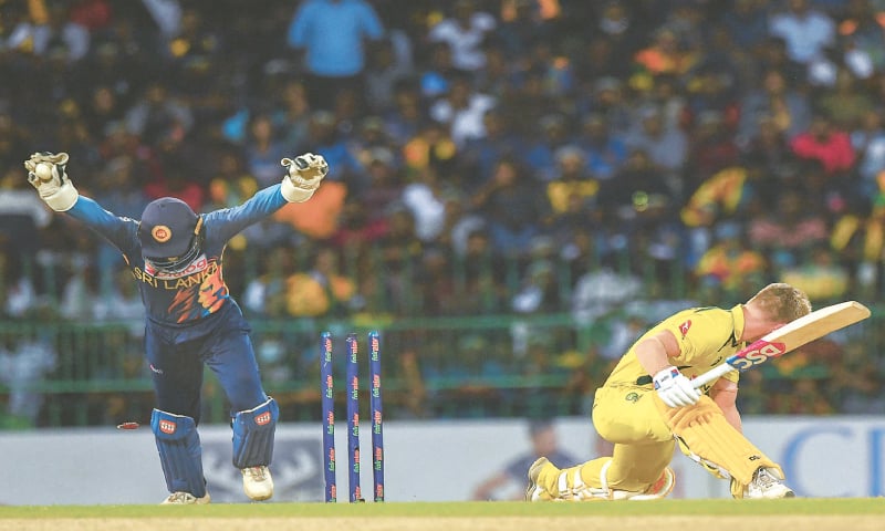 SRI LANKAN wicket-keeper Niroshan Dickwella reacts after stumping Australian opener David Warner.—AFP