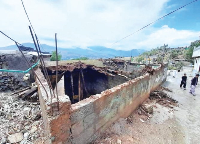 A view of a house damaged in rain in Timergara, Lower Dir. — Dawn