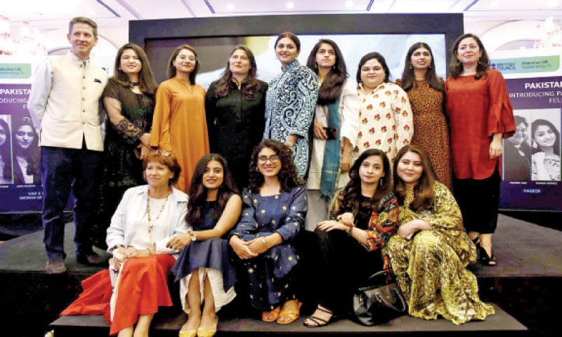 British High Commissioner Dr Christian Turner and Sharmeen Obaid-Chinoy pose for a photograph with upcoming filmmakers at a ceremony in Islamabad on Friday night. — Photo by Tanveer Shahzad