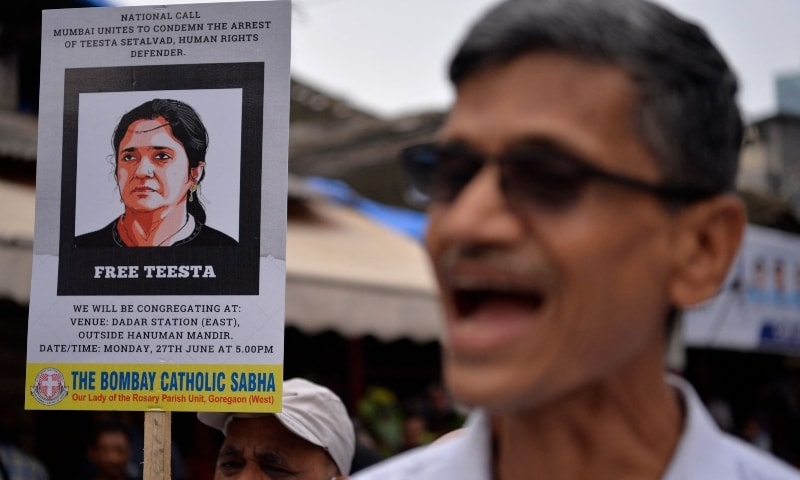 A demonstrator holds a placard and shouts slogans during a protest in Mumbai, India, June 27. — AFP