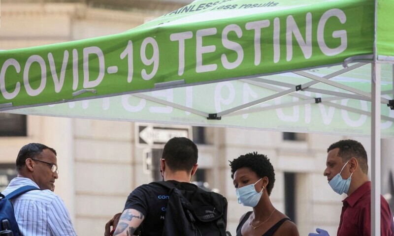 People wait to take coronavirus disease tests at a pop-up testing site in New York City, US, July 11. — Reuters