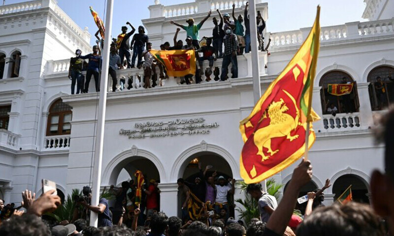 Protesters storm the office of Sri Lankan Prime Minister Ranil Wickremesinghe on Wednesday. — AFP