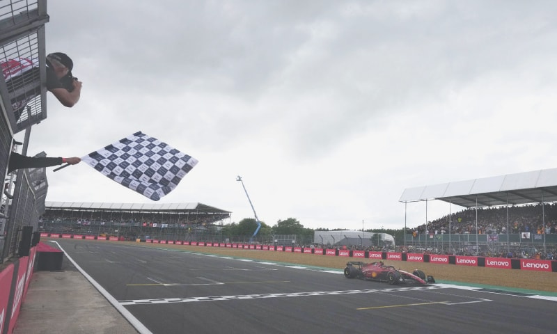 FERRARI’S Carlos Sainz Jr. crosses the line to win the British Grand Prix at the Silverstone Circuit on Sunday.—Reuters