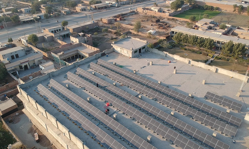 Solar panels are seen on a building on the Multan-Bahawalpur Highway. — Shutterstock