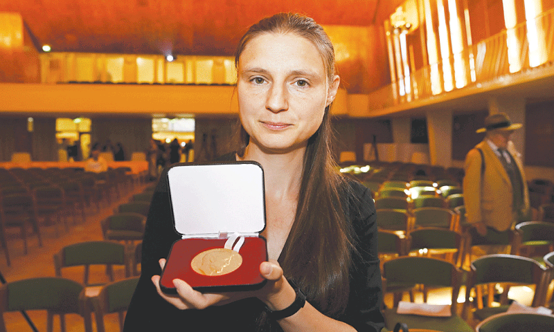 Maryna Viazovska presents her medal during the International Congress of Mathematicians 2022 (ICM 2022) in Helsinki on Tuesday.—AFP