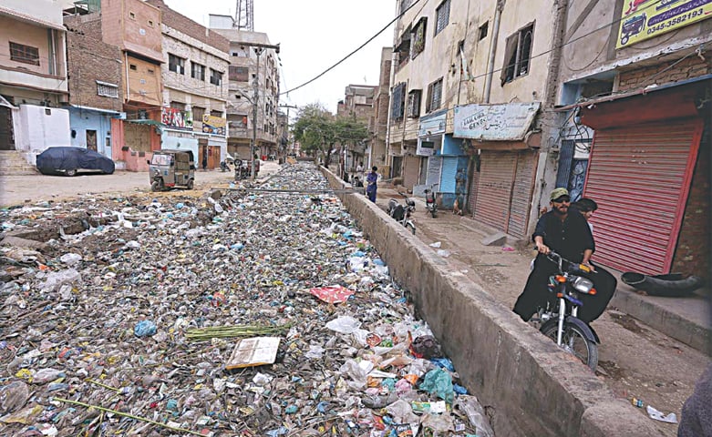 HYDERABAD: The drain in Goods Naka area of Hyderabad is totally choked with garbage on Wednesday, which restricts flow of sewage causing flooding in the locality during rains. —APP HYDERABAD: The drain in Goods Naka area of Hyderabad is totally choked with garbage on Wednesday, which restricts flow of sewage causing flooding in the locality during rains. —APP
