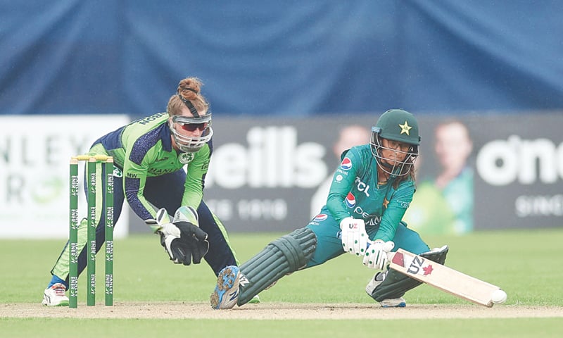 PAKISTAN opener Muneeba Ali attempts an unorthodox shot as Ireland wicket-keeper Mary Waldron looks on during their T20 tri-series match at the Bready Cricket Club ground.&mdash;courtesy PCB