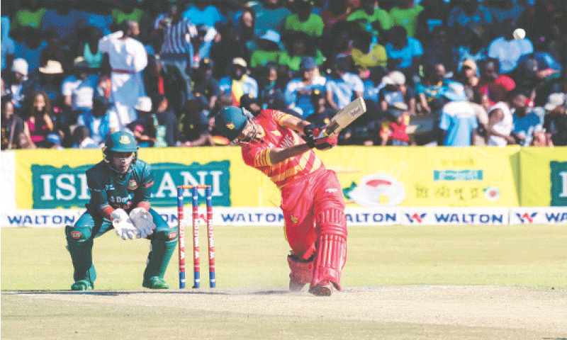 ZIMBABWE batter Sikandar Raza plays a shot as Bangladesh wicket-keeper Mushfiqur Rahim looks on during the second One-day International at the Harare Sports Club on Sunday.—AFP