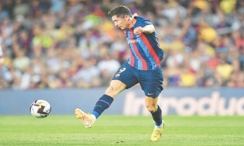 BARCELONA: Barcelona’s Robert Lewandowski shoots during the La Liga match against Rayo Vallecano at the Camp Nou Stadium.—AFP