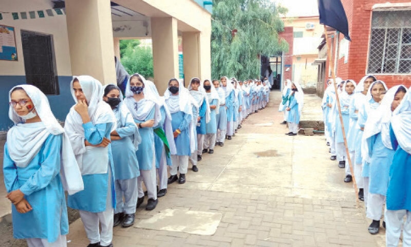 MUZAFFARGARH: Girls queue up to cast their votes in student council elections. — Dawn