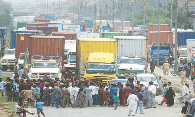 PROTESTERS block the main road in Korangi over increase in KE bills.—PPI PROTESTERS block the main road in Korangi over increase in KE bills.—PPI