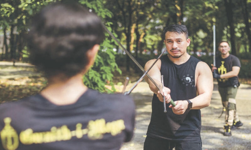 MEMBERS of Gwaith-i-Megyr group practise sword-fighting techniques, known as Historical European Martial Arts, at a park in Jakarta.—AFP MEMBERS of Gwaith-i-Megyr group practise sword-fighting techniques, known as Historical European Martial Arts, at a park in Jakarta.—AFP