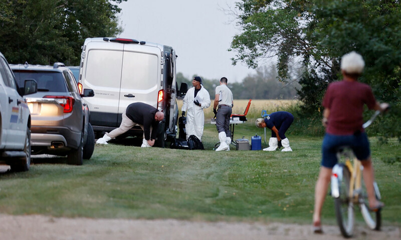 A police forensics team investigates a crime scene after multiple people were killed and injured in a stabbing spree in Weldon, Saskatchewan, Canada on September 4, 2022. &mdash; Reuters