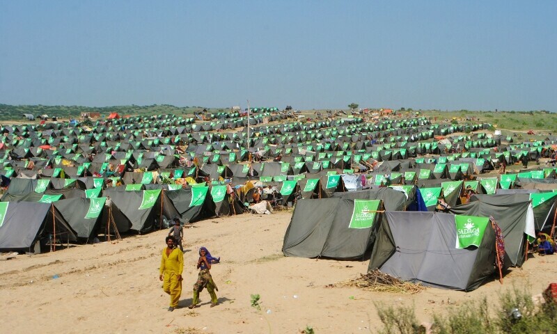 Internally displaced people take refuge at a makeshift camp in the flood-hit Chachro of Sindh province on September 19, 2022. — AFP