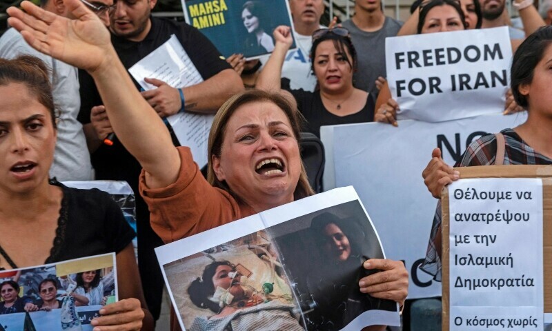 A woman reacts as she takes part in a protest over the death in custody of Mahsa Amini, outside the Iranian embassy in the Cypriot capital Nicosia on September 27, 2022. — AFP