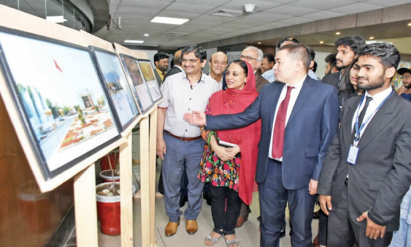 Kyrgyz Ambassador Ulanbek Totuiaev briefs guests during the photo exhibition in Islamabad on Friday. &mdash; Online