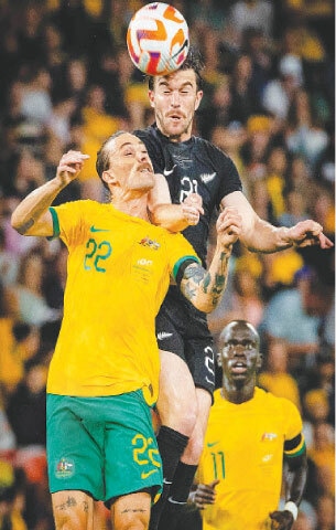 BRISBANE: Australia’s Jackson Irvine (L) and New Zealand’s Tim Payne vie for the ball during a friendly match at the Suncorp Stadium.—AFP