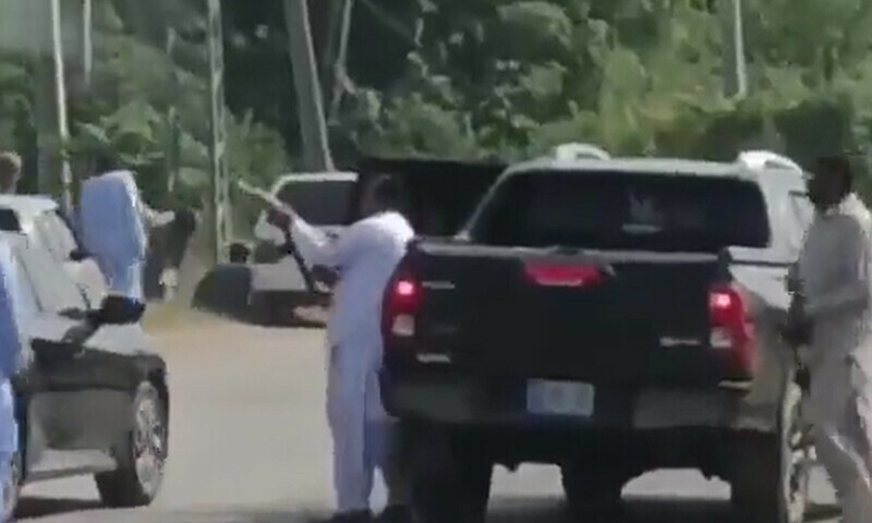 A screengrab showing a man firing into the air in what is identified as Islamabad&rsquo;s Chak Shahzad area. &mdash; Screengrab via Twitter