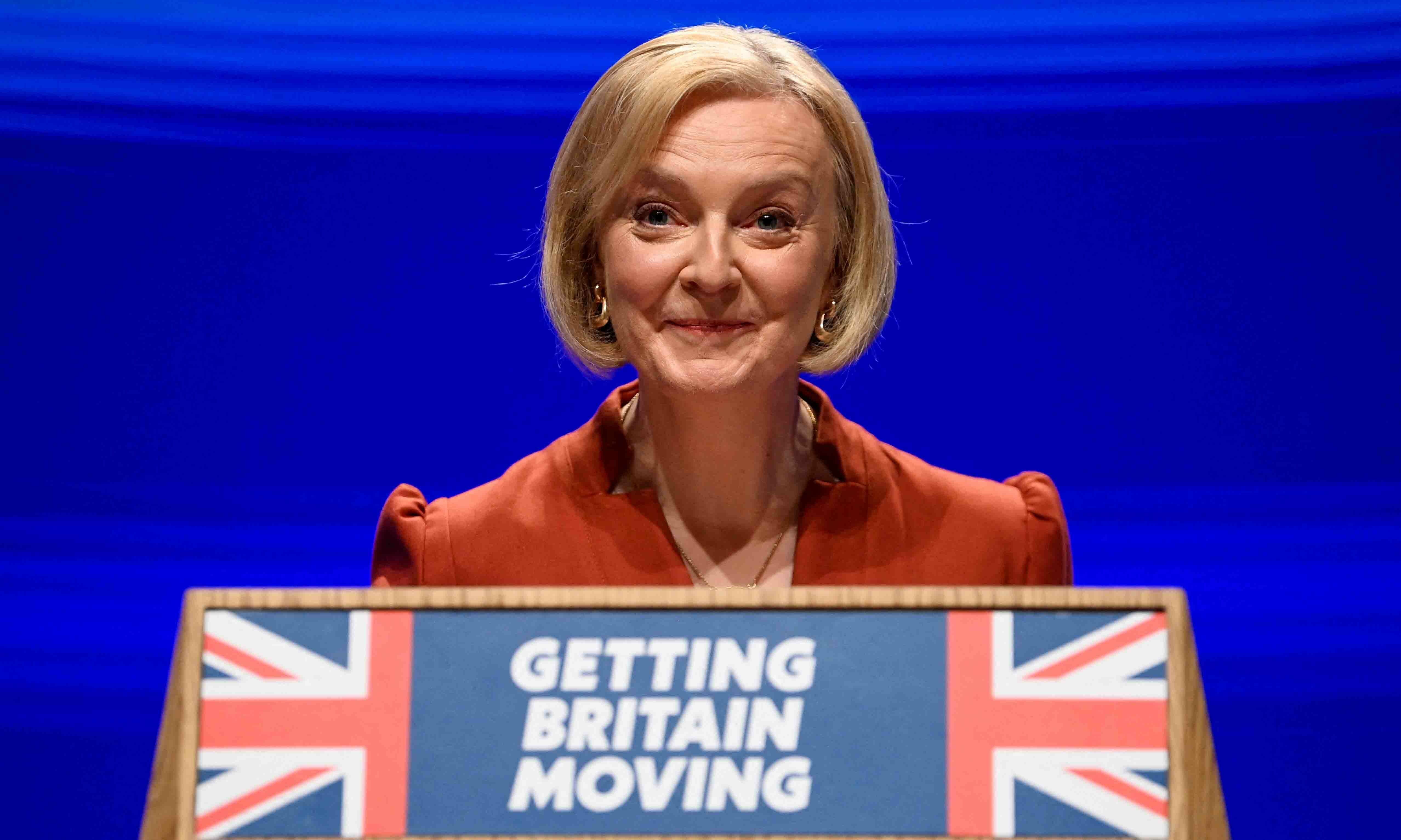 British Prime Minister Liz Truss speaks on stage at Britain's Conservative Party's annual conference in Birmingham on October 5. — Reuters British Prime Minister Liz Truss speaks on stage at Britain's Conservative Party's annual conference in Birmingham on October 5. — Reuters