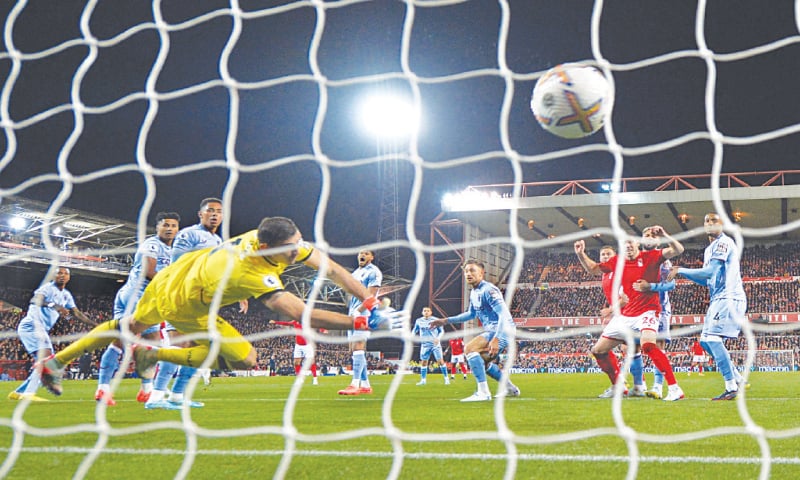 NOTTINGHAM: Nottingham Forest&rsquo;s Emmanuel Dennis (obscure) scores against Aston Villa during their Premier League match at The City Ground.&mdash;Reuters