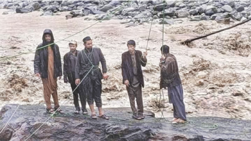 Obaidullah (third from left) was the only one of the five stranded men who survived their tragic ordeal in Kohistan. &mdash;Dawn