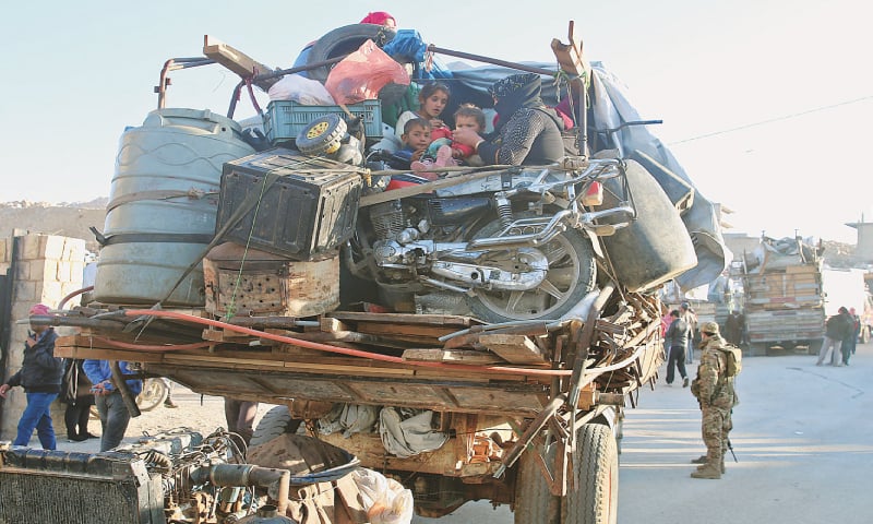 Arsal: Syrian refugees prepare to leave Lebanon towards Syrian territory through the Wadi Hamid crossing on Wednesday.—AFP Arsal: Syrian refugees prepare to leave Lebanon towards Syrian territory through the Wadi Hamid crossing on Wednesday.—AFP