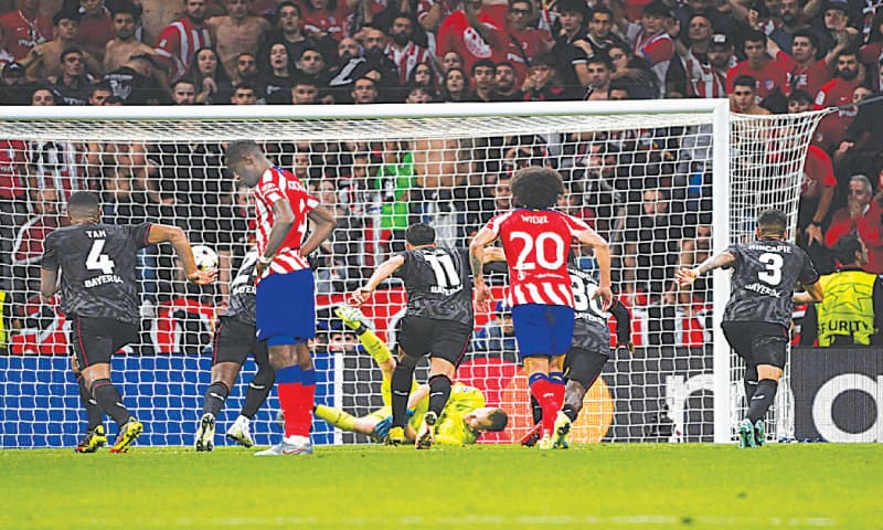 MADRID: Bayer Leverkusen goalkeeper Lukas Hradecky stops a penalty during the Champions League match against Atletico Madrid at the Wanda Metropolitano.—AFP