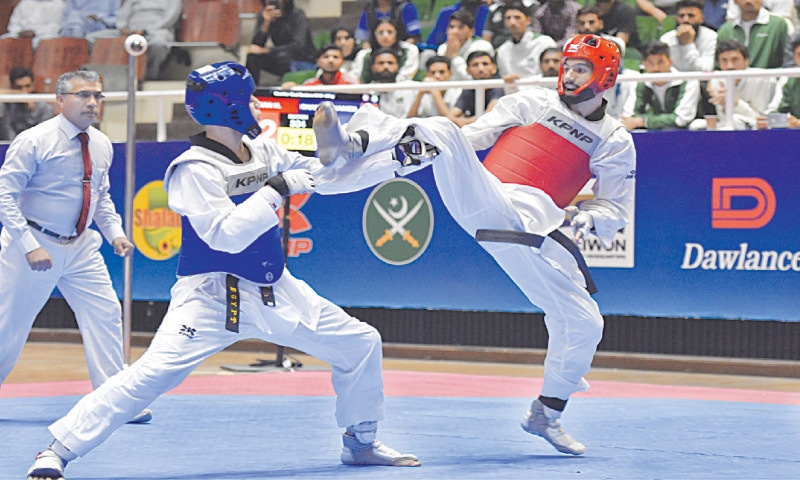 Pakistan's Haroon Khan (R) competes against Hisham Mohamed 
of Egypt during the -58kg semi-final of the Asian Open International Taekwondo Championship at Liaquat Gymnasium on Friday.
&mdash;Tanveer Shahzad/White Star