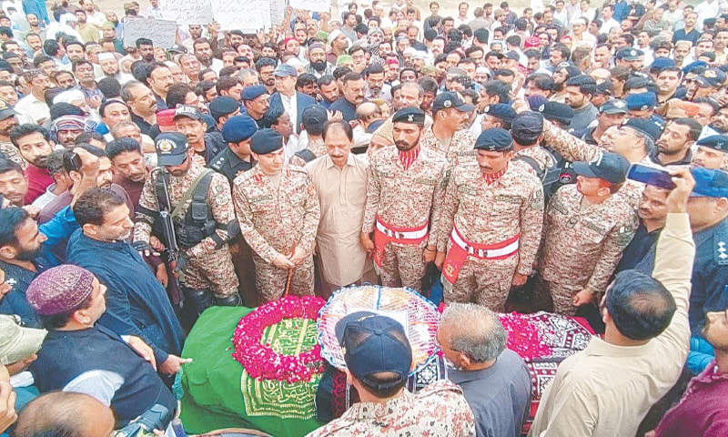 OFFICERS and personnel of law enforcement agencies along with other mourners offer funeral prayers of Inspector Abdul Malik Kamangar at the Sukkur Police Lines  on Sunday.&mdash;PPI