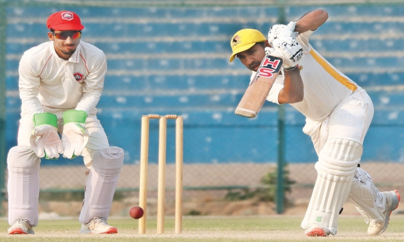 KARACHI: Sindh batter Sarfraz Ahmed drives during the Quaid-i-Azam Trophy match against Northern at the National Stadium on Wednesday.&mdash;courtesy PCB