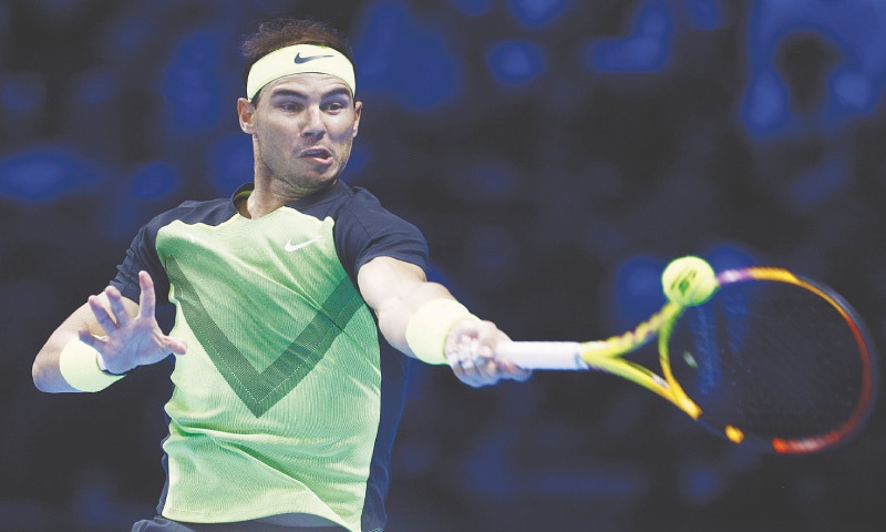 Spain’s Rafael Nadal hits a return to Casper Ruud of Norway during their ATP Finals match at Pala Alpitour on Thursday.—Reuters Spain’s Rafael Nadal hits a return to Casper Ruud of Norway during their ATP Finals match at Pala Alpitour on Thursday.—Reuters
