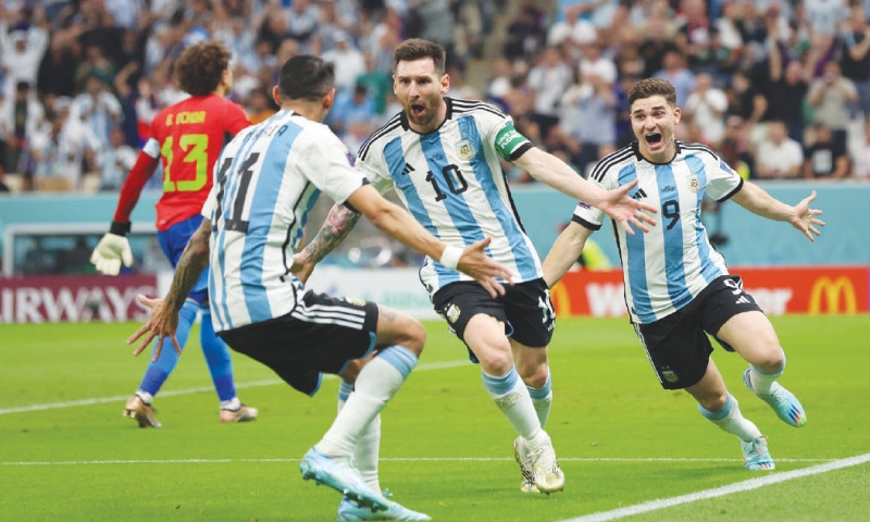 Lionel Messi celebrates his team’s first goal with Julian Alvarez and Angel Di Maria.­—Reuters