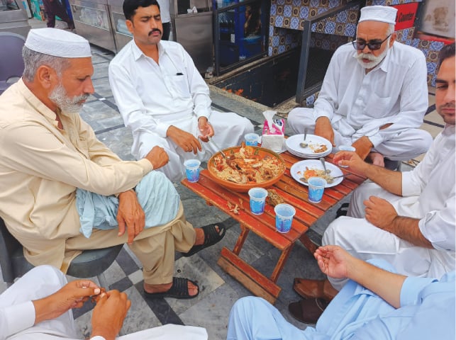 Gentlemen enjoying a hearty meal