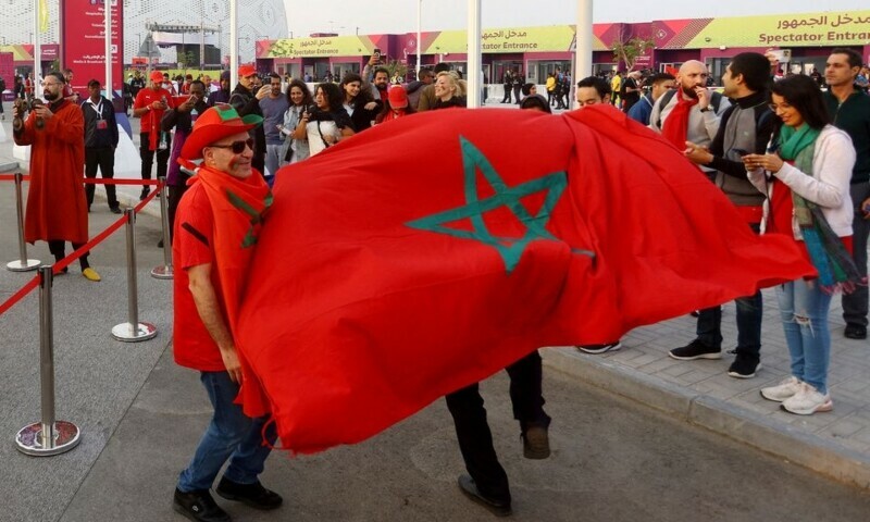 Morocco fans are pictured with the flag of Morocco outside the stadium before the match against Portugal at the Al Thumama Stadium, Doha, Qatar, Dec 10. &mdash; Reuters