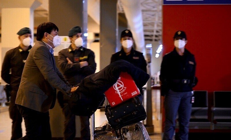 A chinese traveller leaves the arrival hall of Rome&ndash;Fiumicino International Airport, near Rome, on Thursday (Dec 29) after being tested for Covid-19 . &mdash; AFP